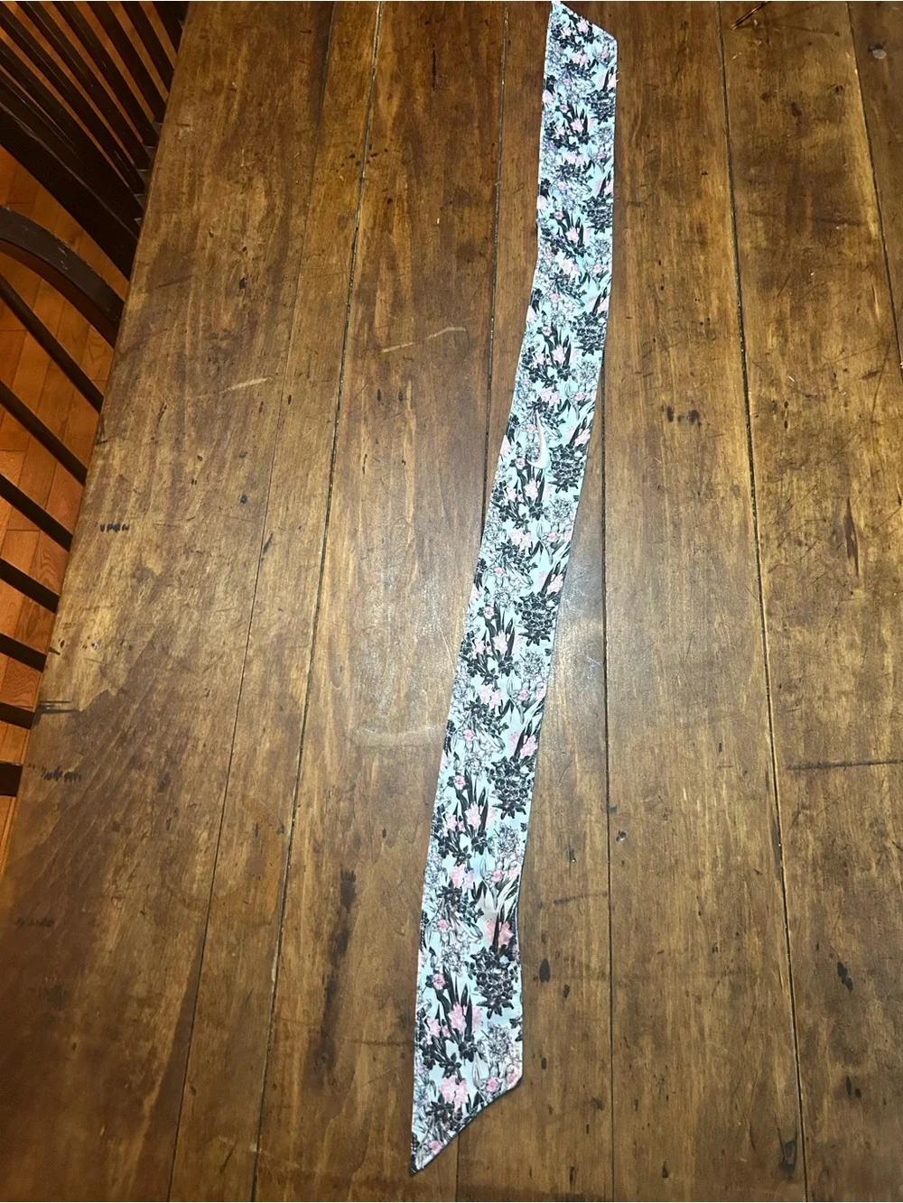 1 Floral blue pink and black Nike headband and 1 orange white and green headband